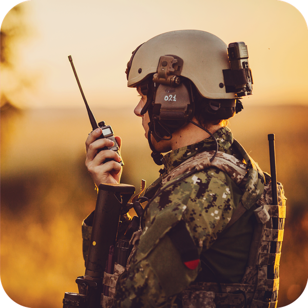Soldier with handheld tactical radio